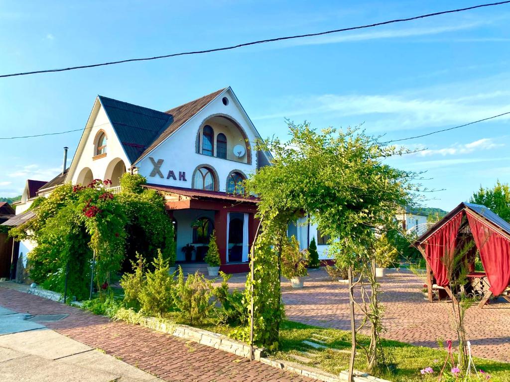 a house on a street with trees in front of it at Han in Selʼtso