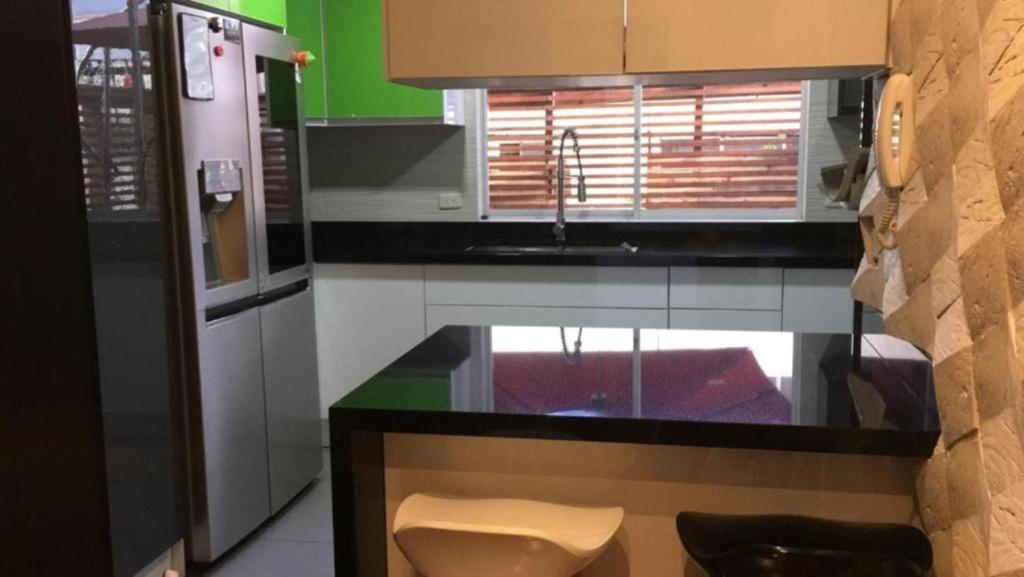 Kuchyň nebo kuchyňský kout v ubytování Misuitehotel La Carolina Quito