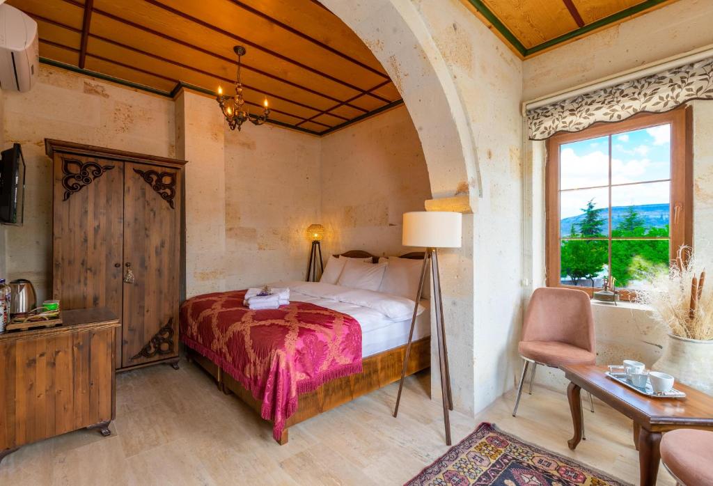 Postel nebo postele na pokoji v ubytování Esens Stone House