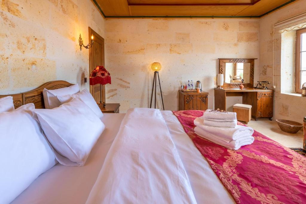Postel nebo postele na pokoji v ubytování Esens Stone House