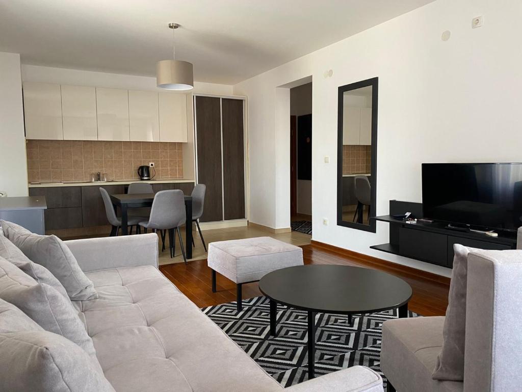 a living room with a couch and a table at Apartman Luka in Vrnjačka Banja