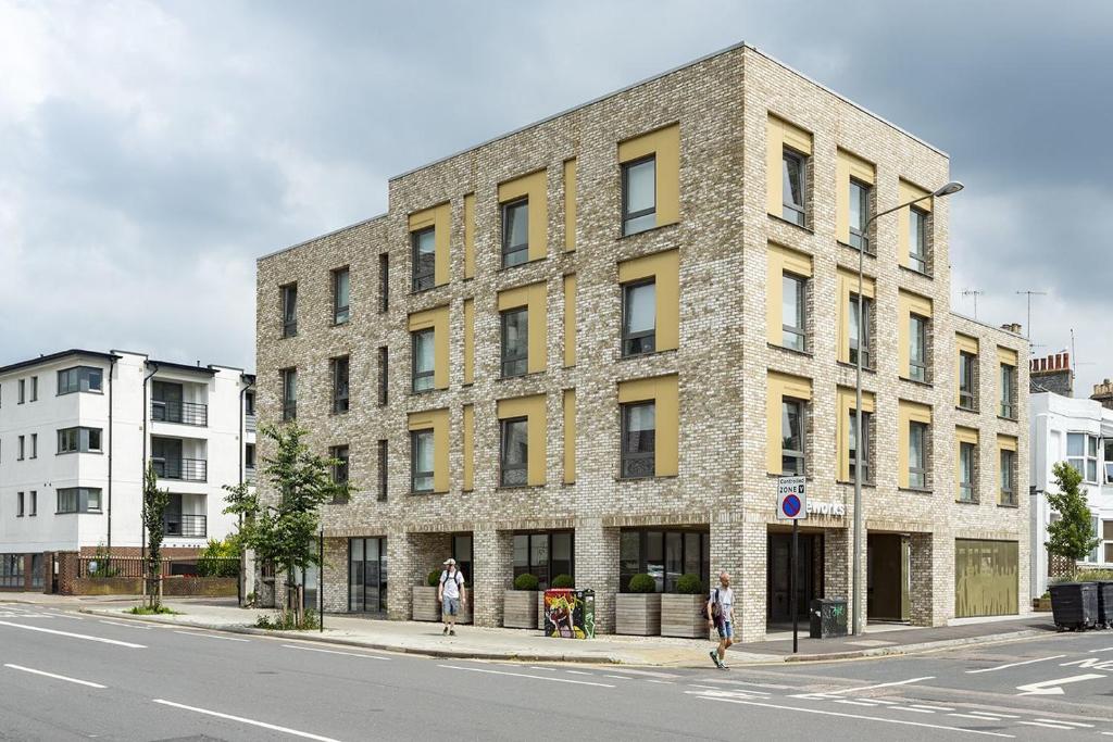 a large brick building on the corner of a street at For Students Only Stoneworks in Brighton in Brighton & Hove