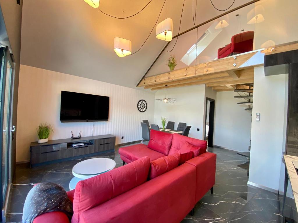 Televízia a/alebo spoločenská miestnosť v ubytovaní Apartament LUX Ustroń