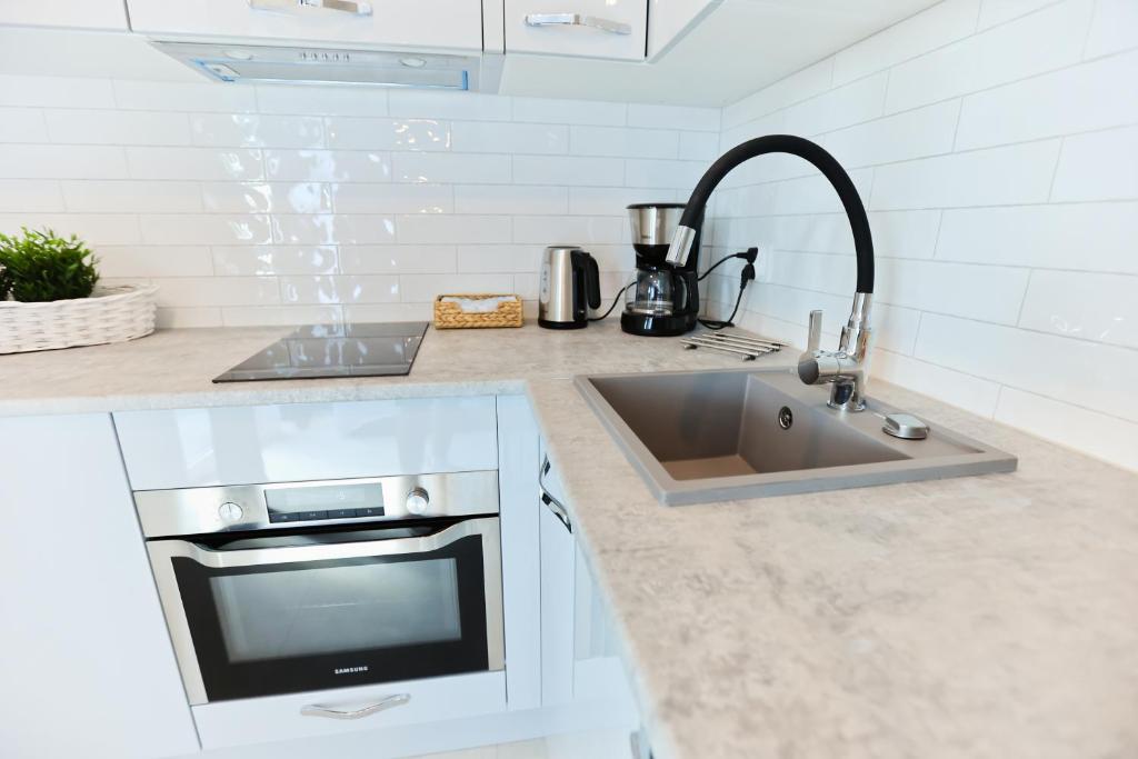 Kuchyňa alebo kuchynka v ubytovaní M&K Apartamenty - Morska Przystań