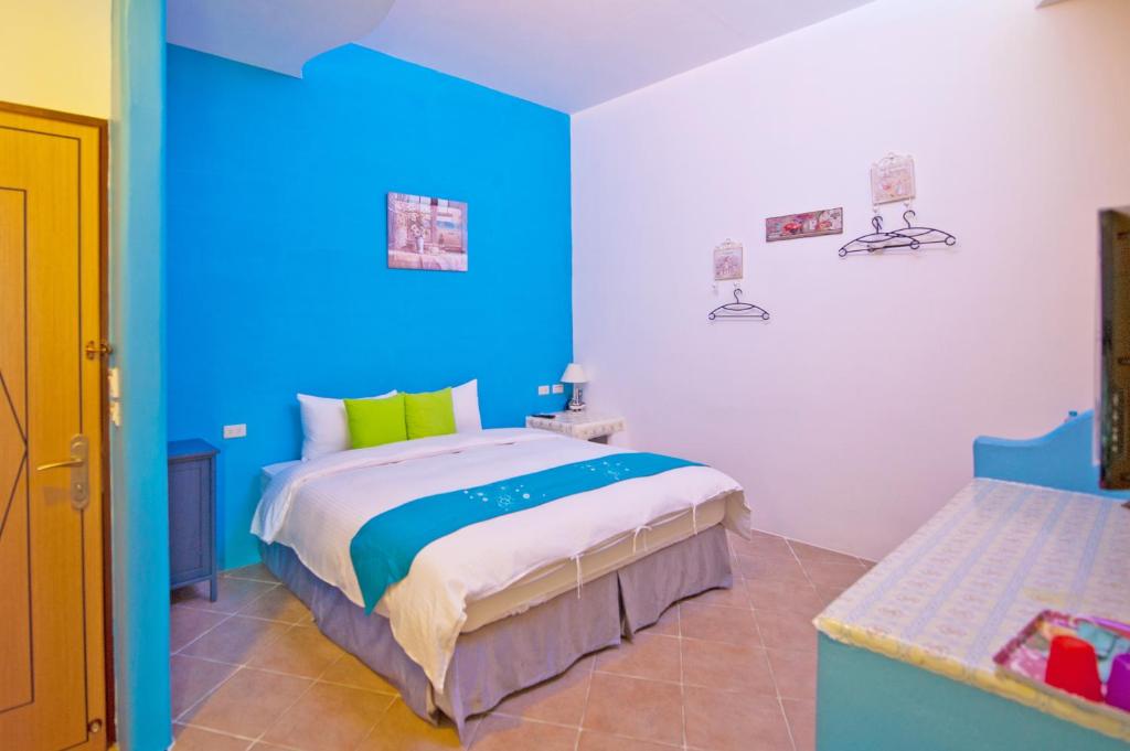Postel nebo postele na pokoji v ubytování Haisu Homestay