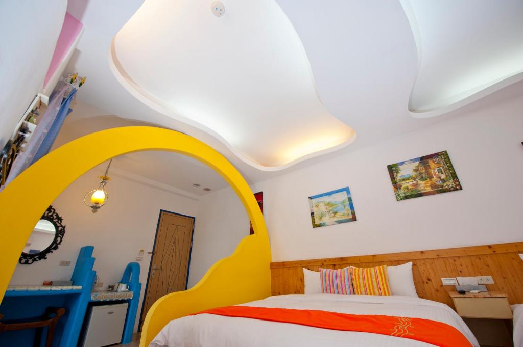 Postel nebo postele na pokoji v ubytování Haisu Homestay