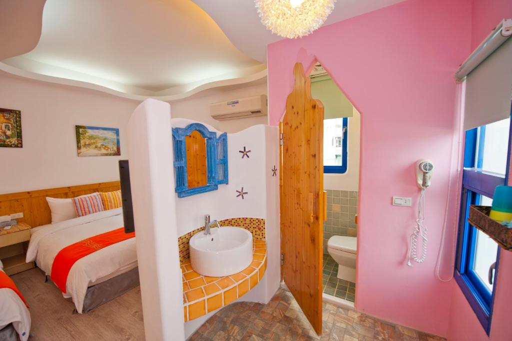 Postel nebo postele na pokoji v ubytování Haisu Homestay