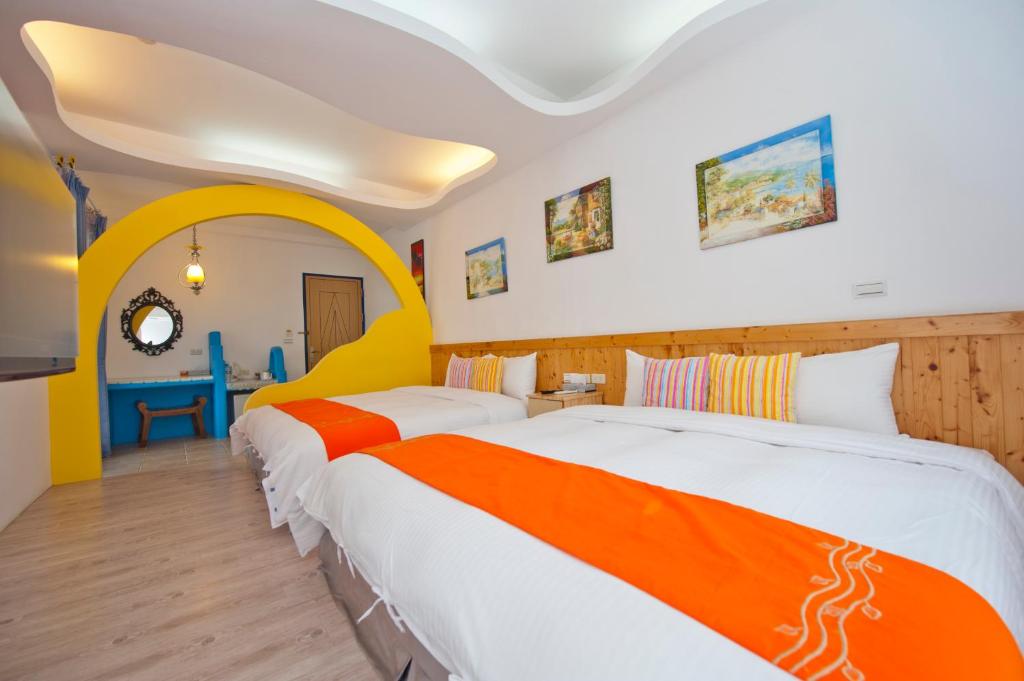 Postel nebo postele na pokoji v ubytování Haisu Homestay