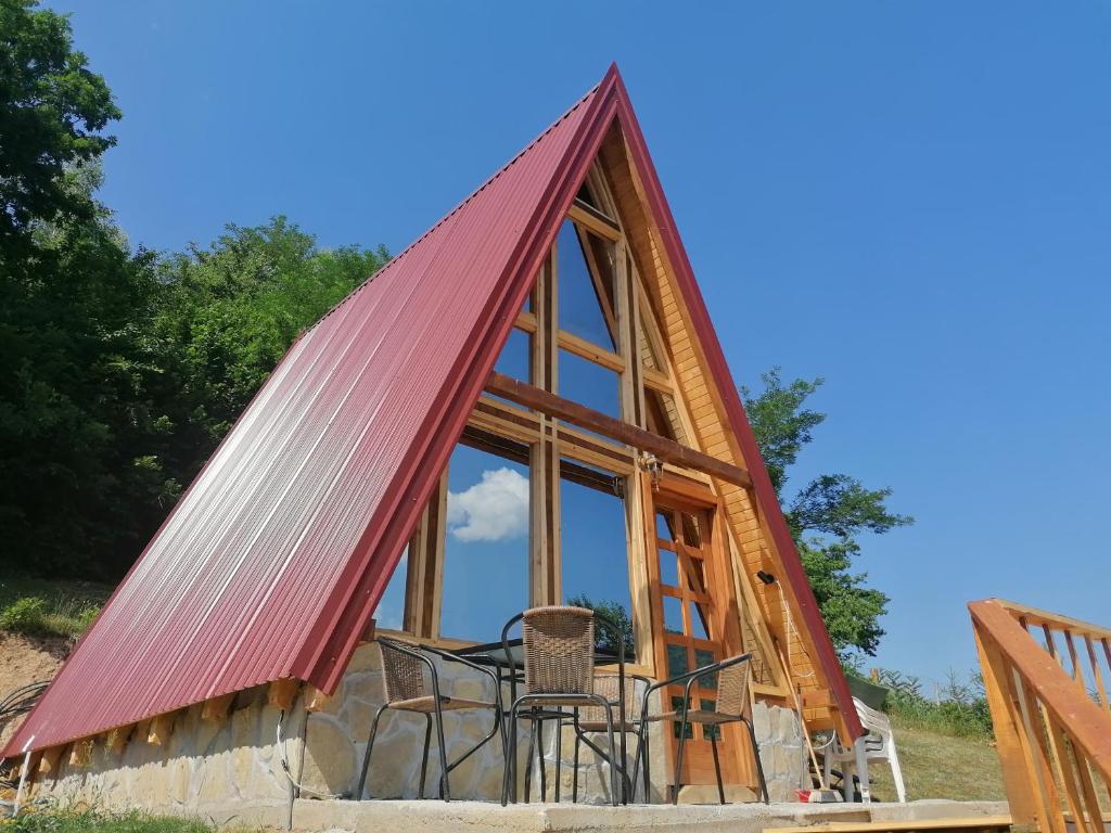 a frame house with a red roof at The view in Bijelo Polje