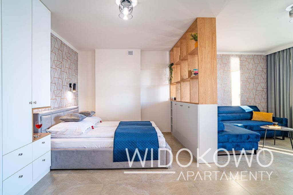 Posteľ alebo postele v izbe v ubytovaní WIDOKOWO Apartamenty