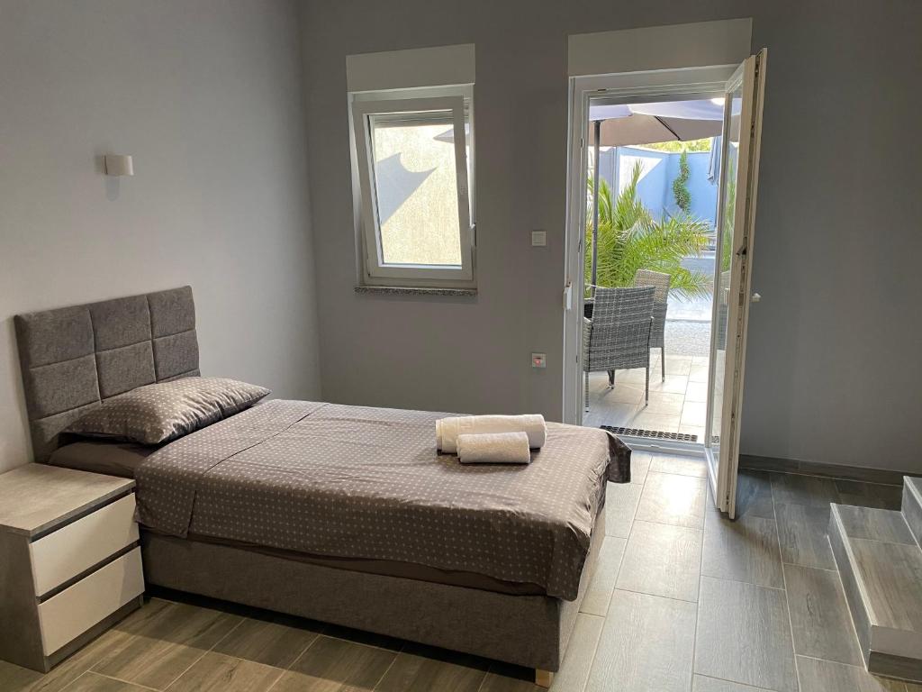 Postel nebo postele na pokoji v ubytování Villa Maleo