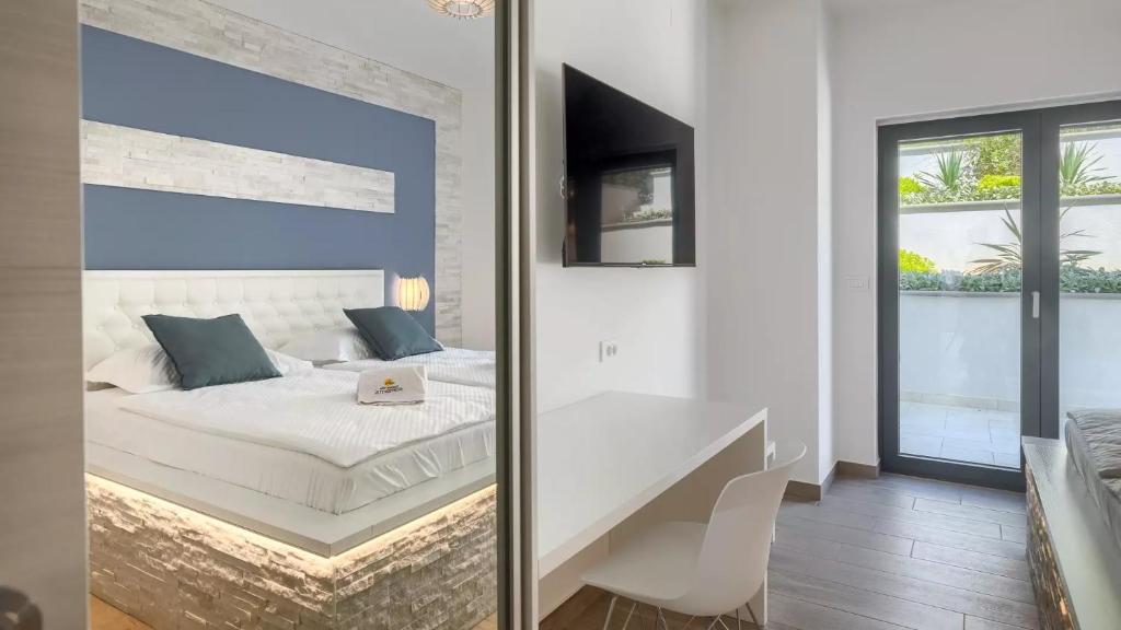 Łóżko lub łóżka w pokoju w obiekcie Luxury Villa Subventus