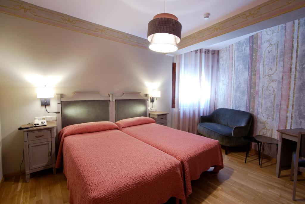 Postel nebo postele na pokoji v ubytování Hotel Bujaruelo