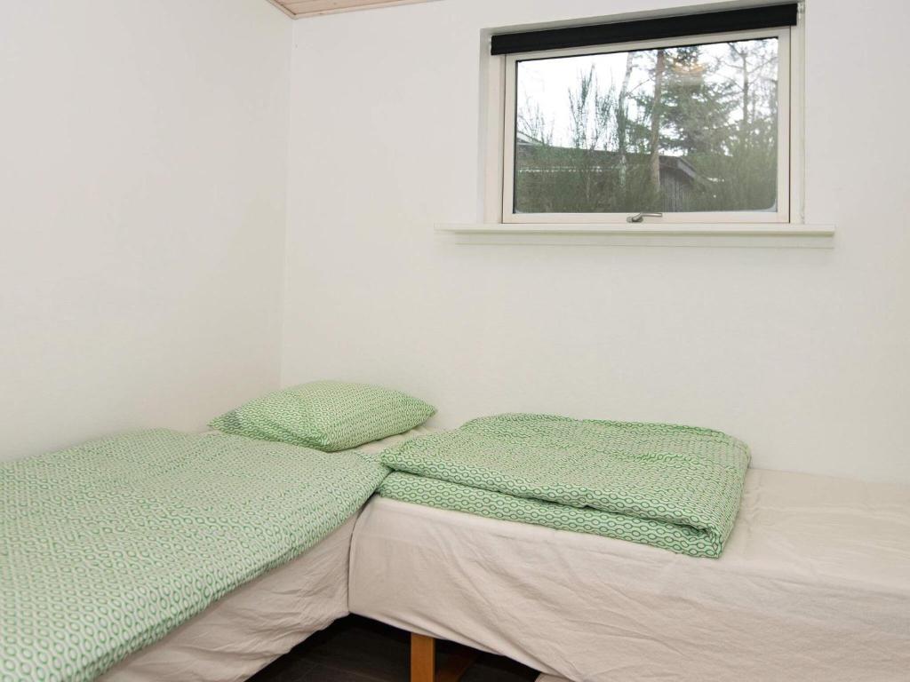 Postel nebo postele na pokoji v ubytování 6 person holiday home in Knebel