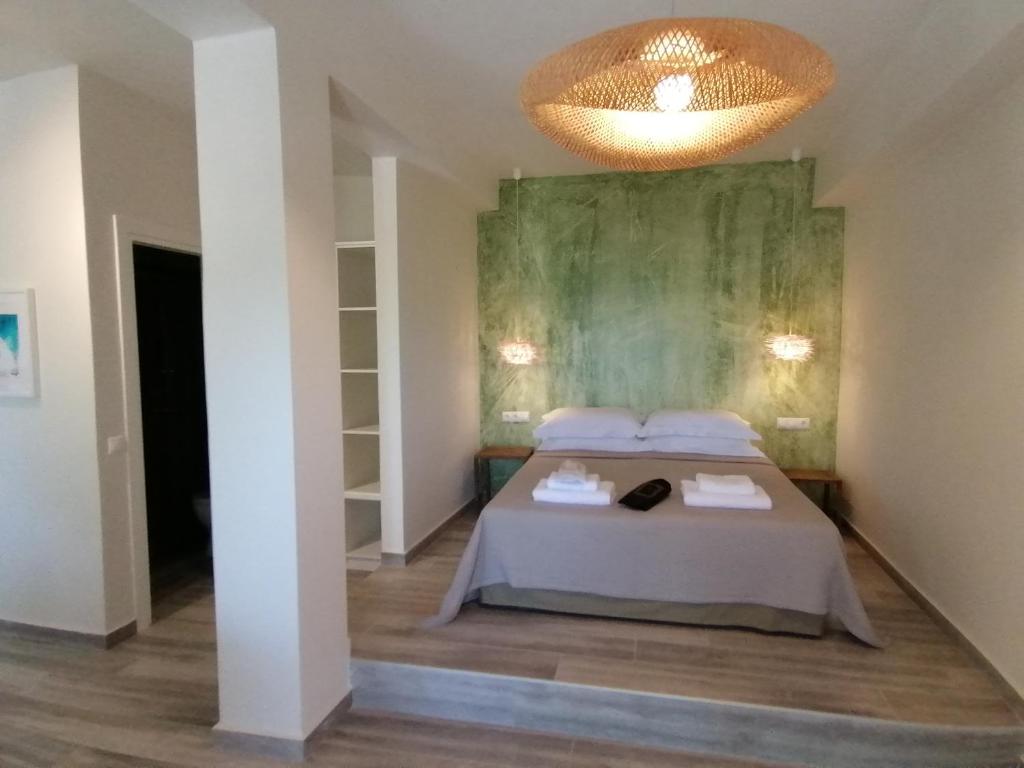 Postel nebo postele na pokoji v ubytování Villa Nena - Studio Suites