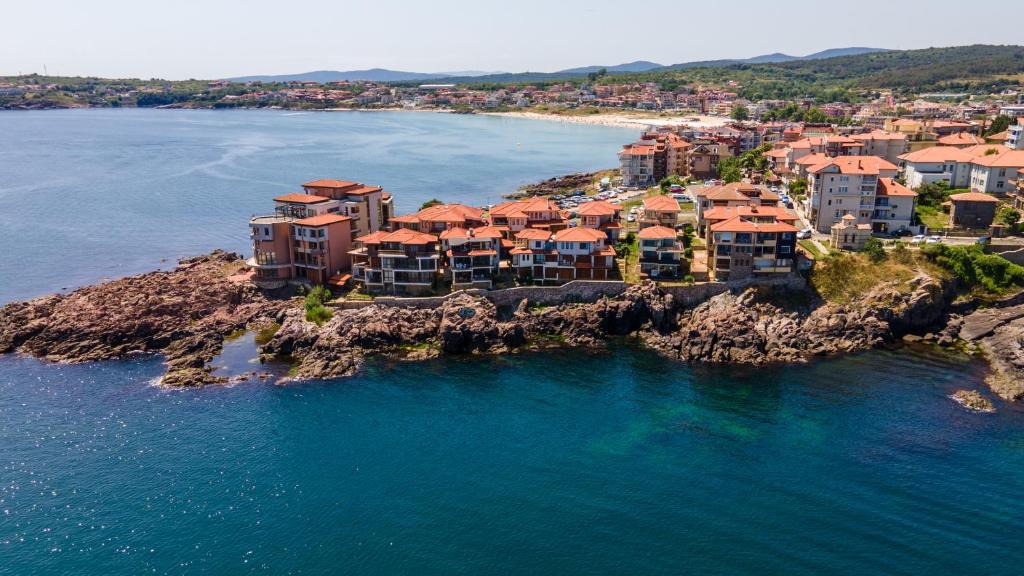 an aerial view of a resort on an island in the water at Sozopol Apartment with Sea View in Sozopol