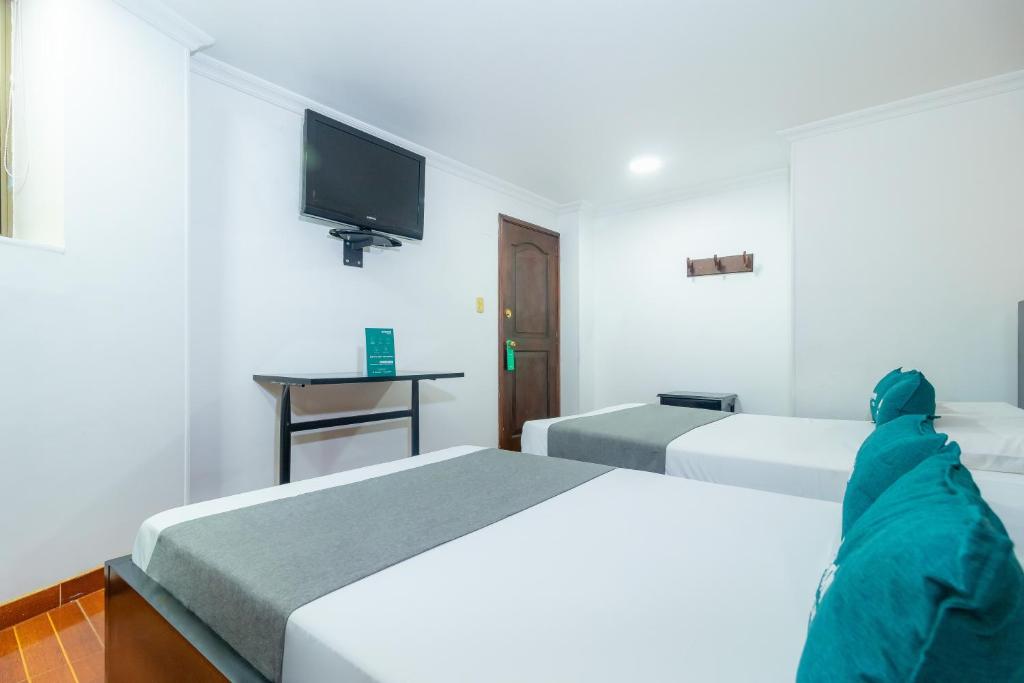 Postel nebo postele na pokoji v ubytování Hotel Ayenda Normandy