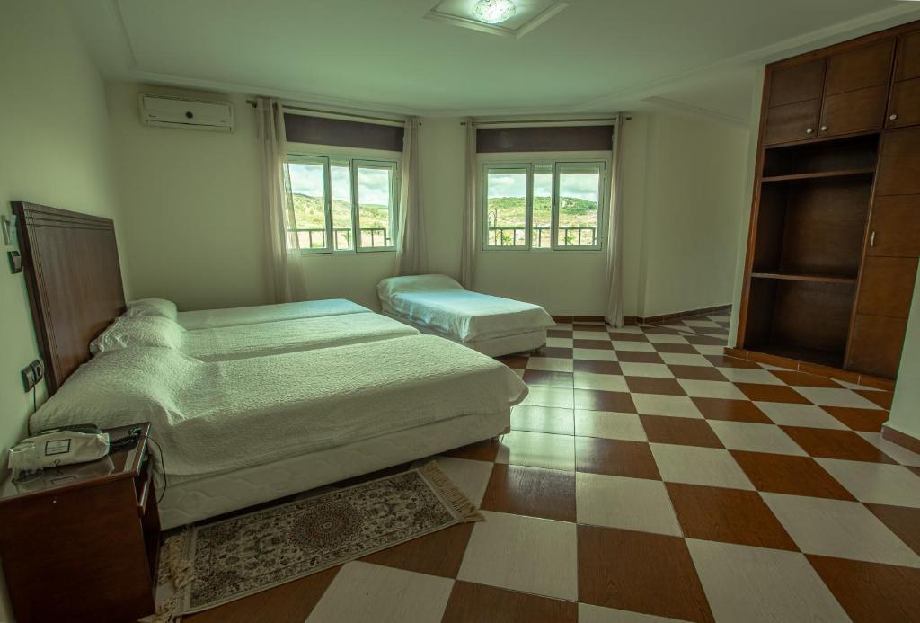 Postel nebo postele na pokoji v ubytování Motel Gzenaya
