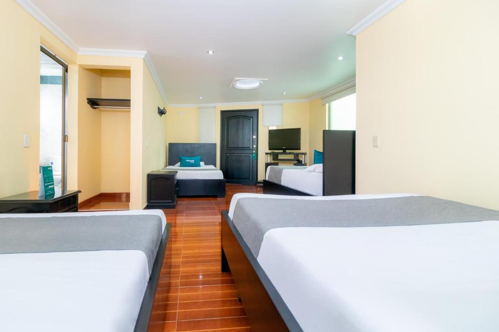 Postel nebo postele na pokoji v ubytování Hotel Ayenda Normandy