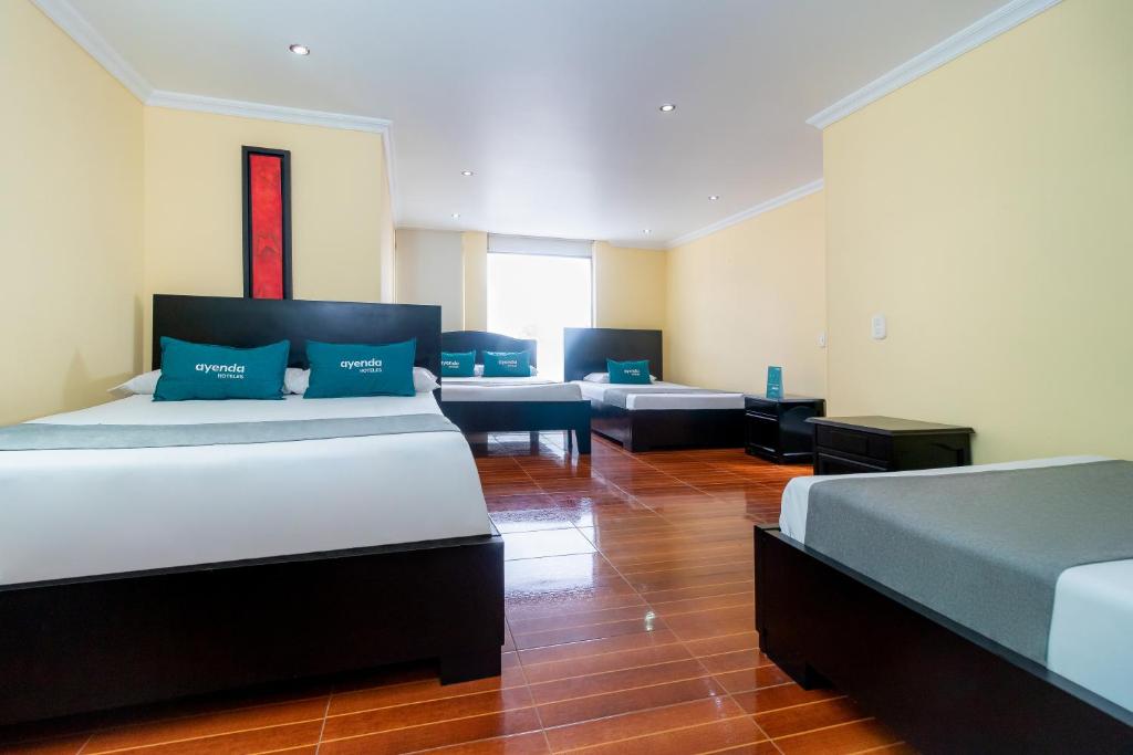 Postel nebo postele na pokoji v ubytování Hotel Ayenda Normandy