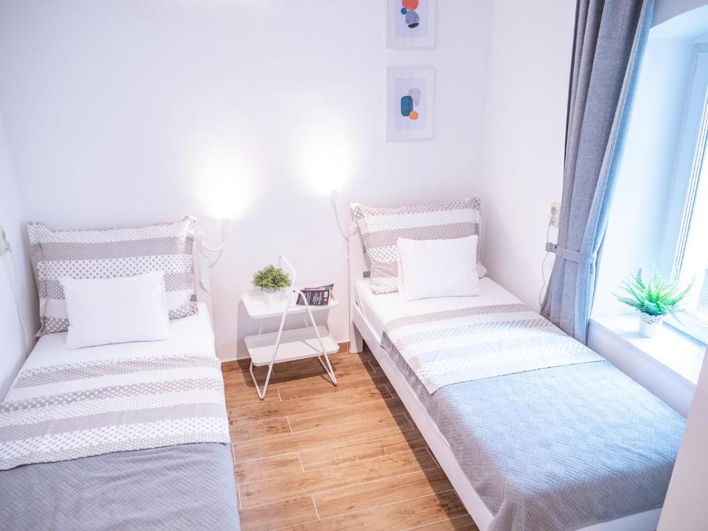 Łóżko lub łóżka w pokoju w obiekcie Charming Pinna Studio