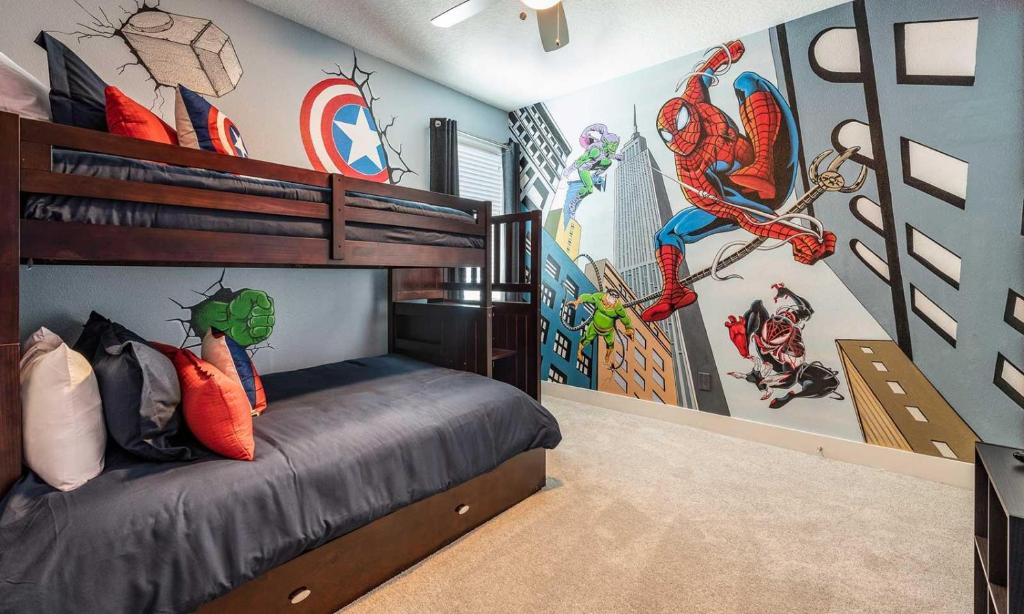 a bedroom with a bed with a captain america mural at Serene Vibrant 4 Bdrm Villa with Games Room at Encore in Orlando