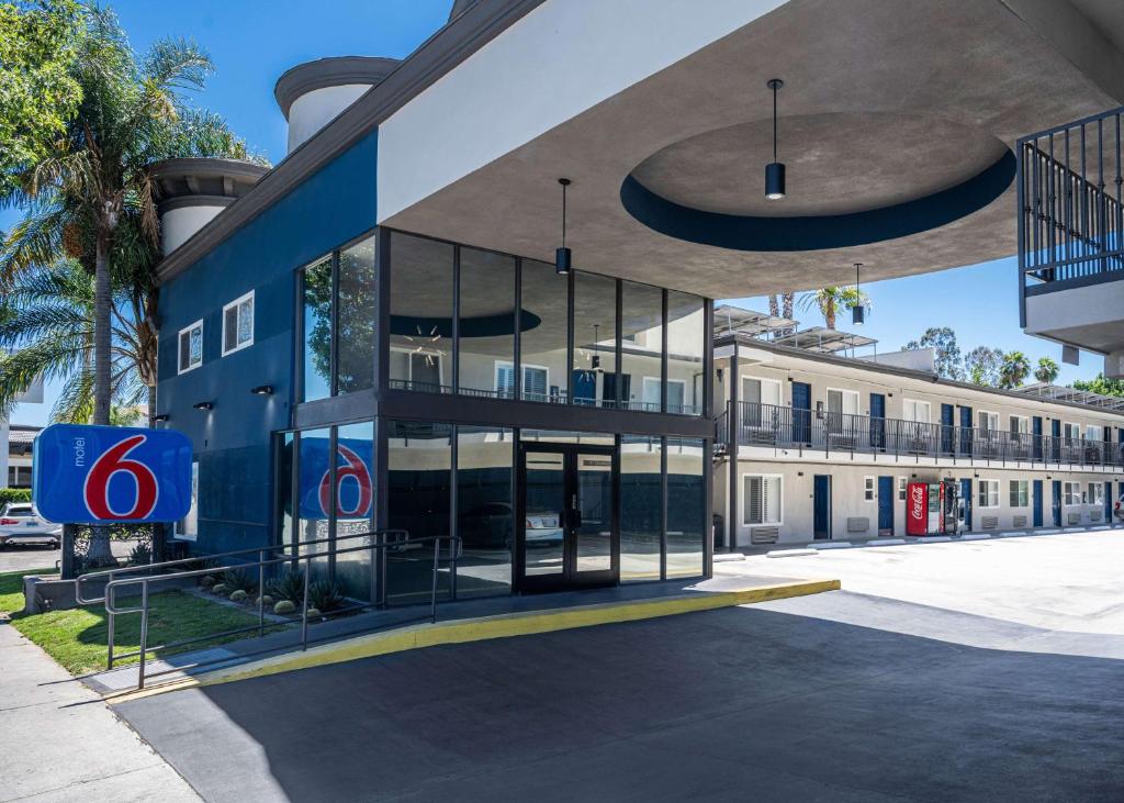 a blue building with a sign in front of it at Motel 6-Anaheim, CA - Convention Center in Anaheim