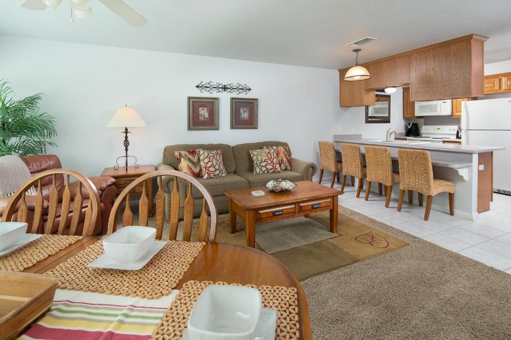 a living room and kitchen with a couch and a table at Urban Bungalow WW C301 in New Braunfels
