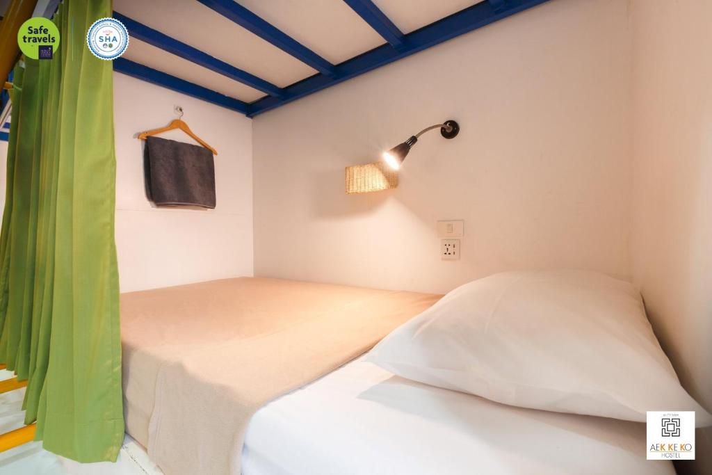 Postel nebo postele na pokoji v ubytování Aekkeko hostel