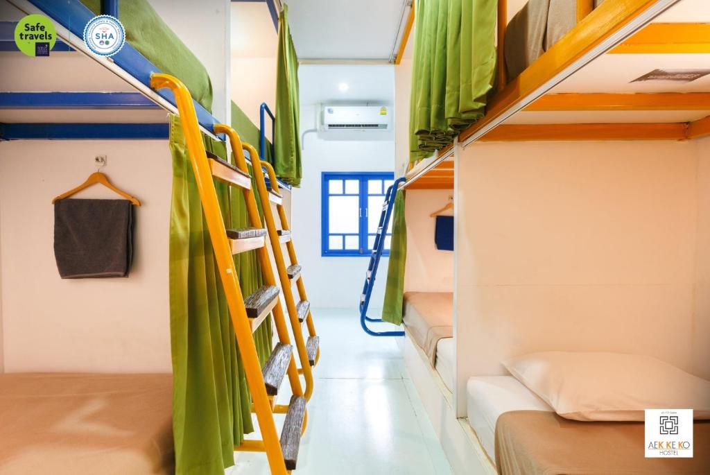 Postel nebo postele na pokoji v ubytování Aekkeko hostel