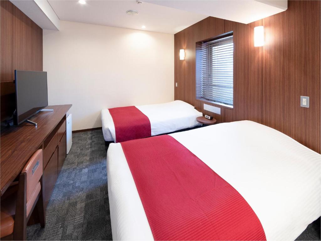 Postel nebo postele na pokoji v ubytování Central Hotel Okayama