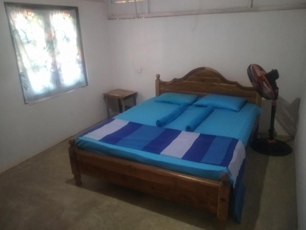 Postel nebo postele na pokoji v ubytování araliya villa