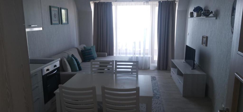 A television and/or entertainment centre at La Mer Residence