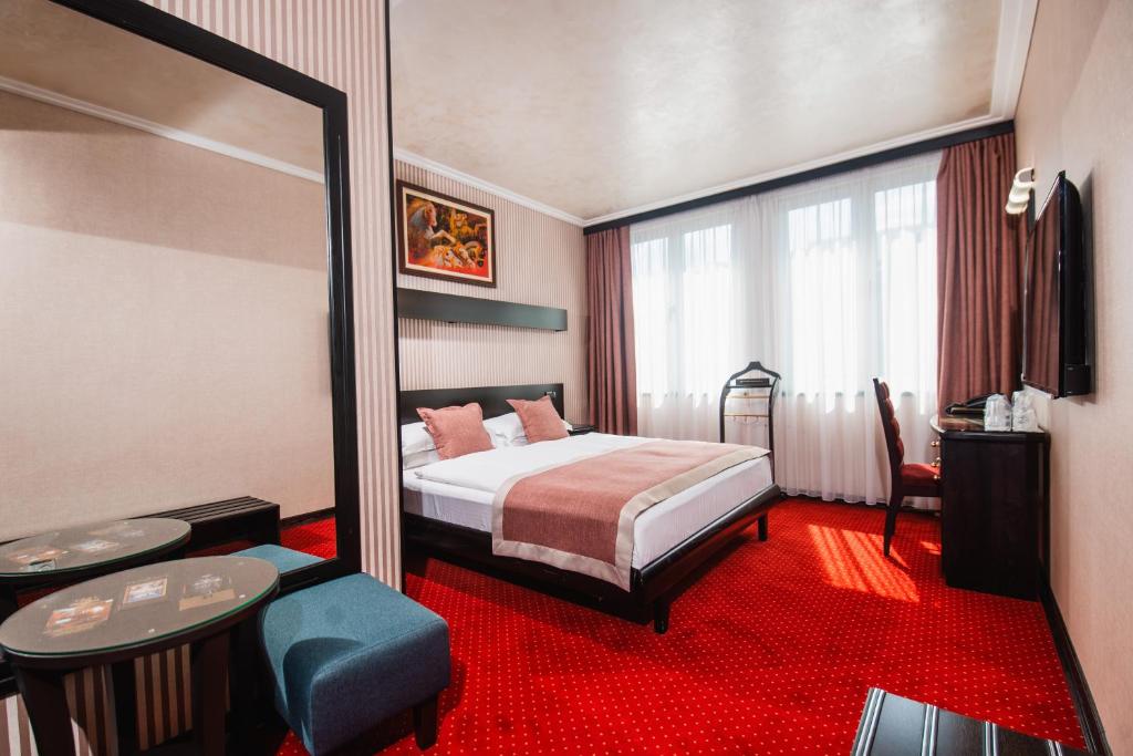 Letto o letti in una camera di Prezident Hotel