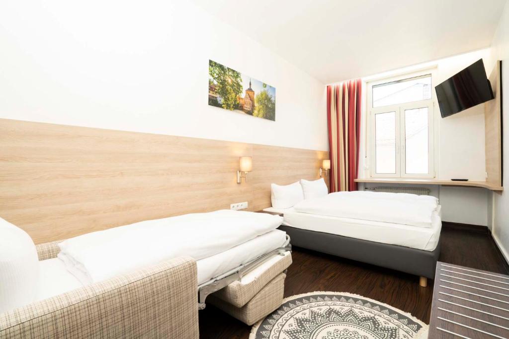 Postel nebo postele na pokoji v ubytování Hotel National