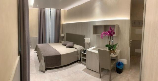 Кровать или кровати в номере Hotel Lamberti