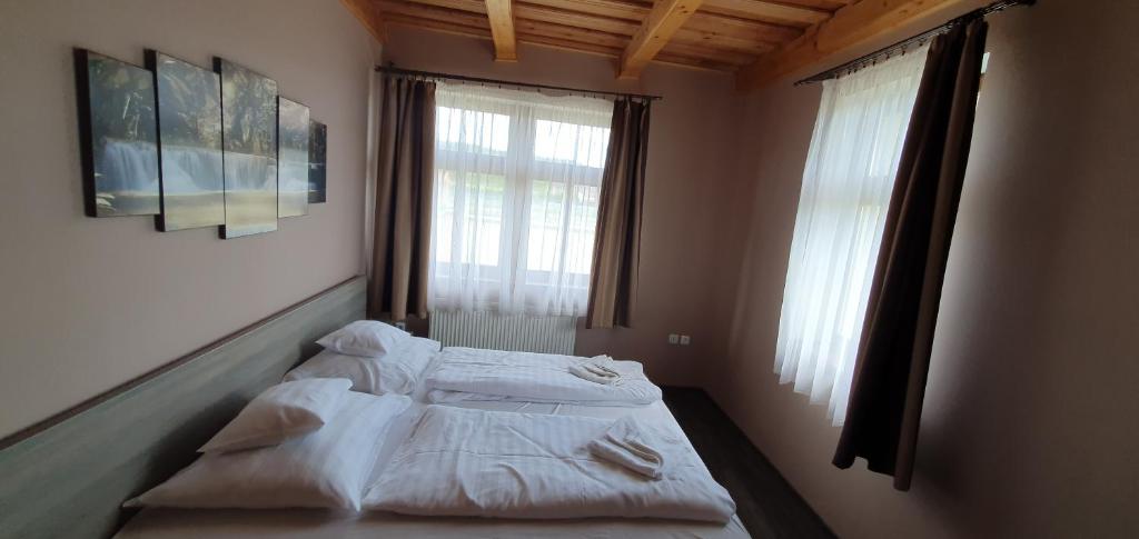 Voodi või voodid majutusasutuse Elringat-lak Apartmanház toas