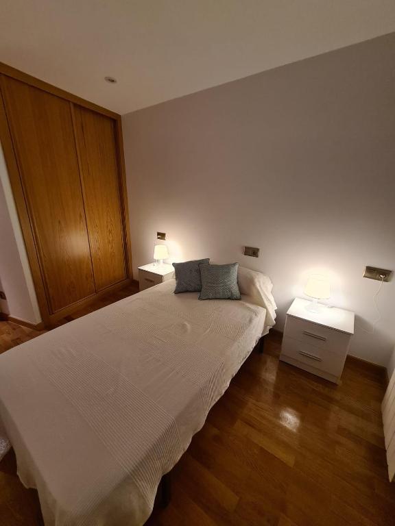 A bed or beds in a room at APARTAMENTOS VIVE
