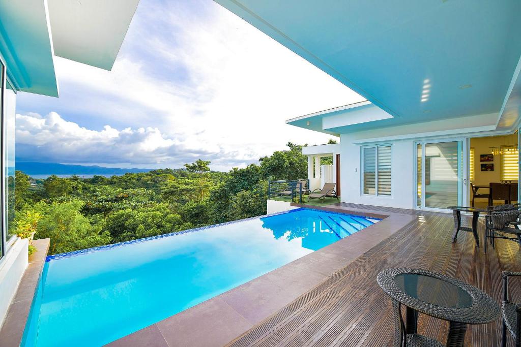 a swimming pool in a house with a view at One Hagdan Villas in Boracay