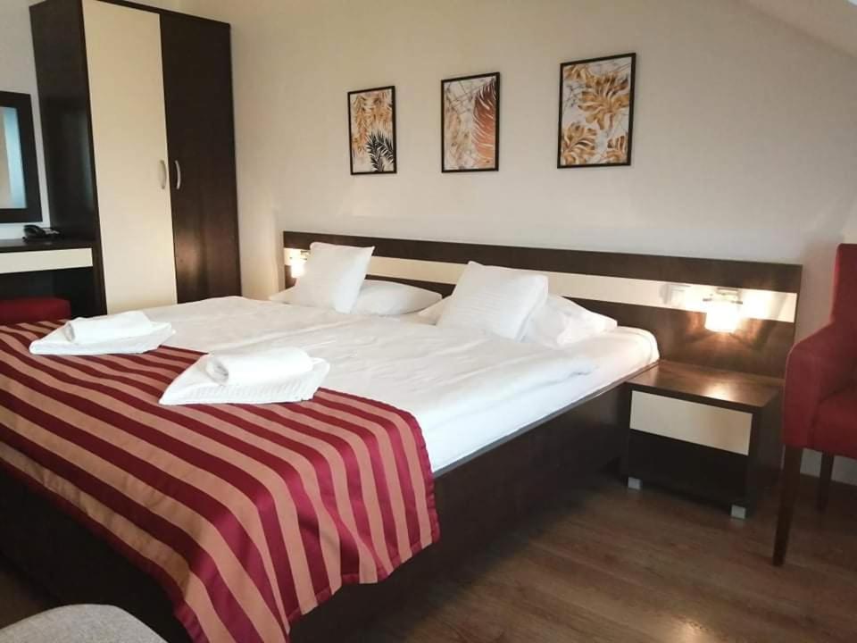 Postel nebo postele na pokoji v ubytování Apartmán Athos Bešeňová - Hotel Bešeňová