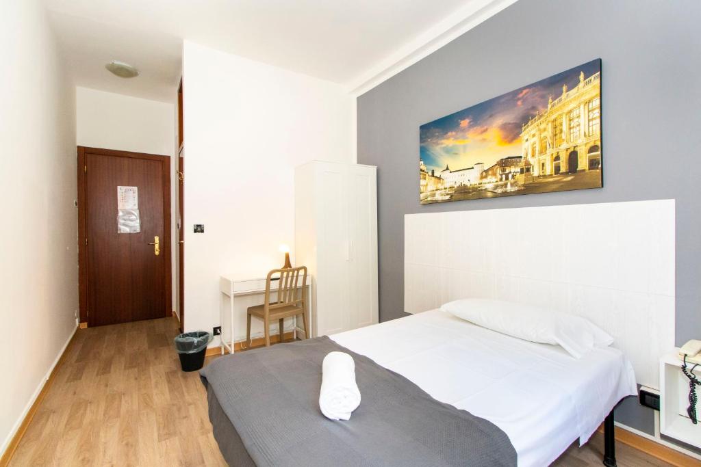 Postel nebo postele na pokoji v ubytování Hotel Cristallo Torino