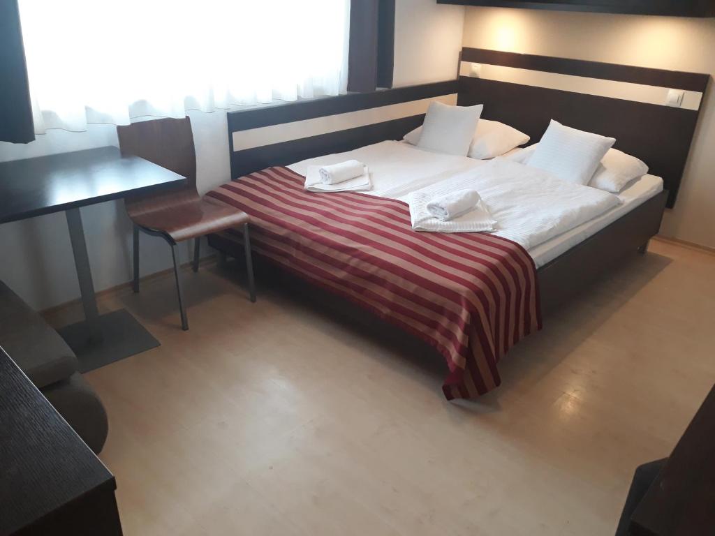 Posteľ alebo postele v izbe v ubytovaní Apartmán Raja Bešeňová - Hotel Bešeňová