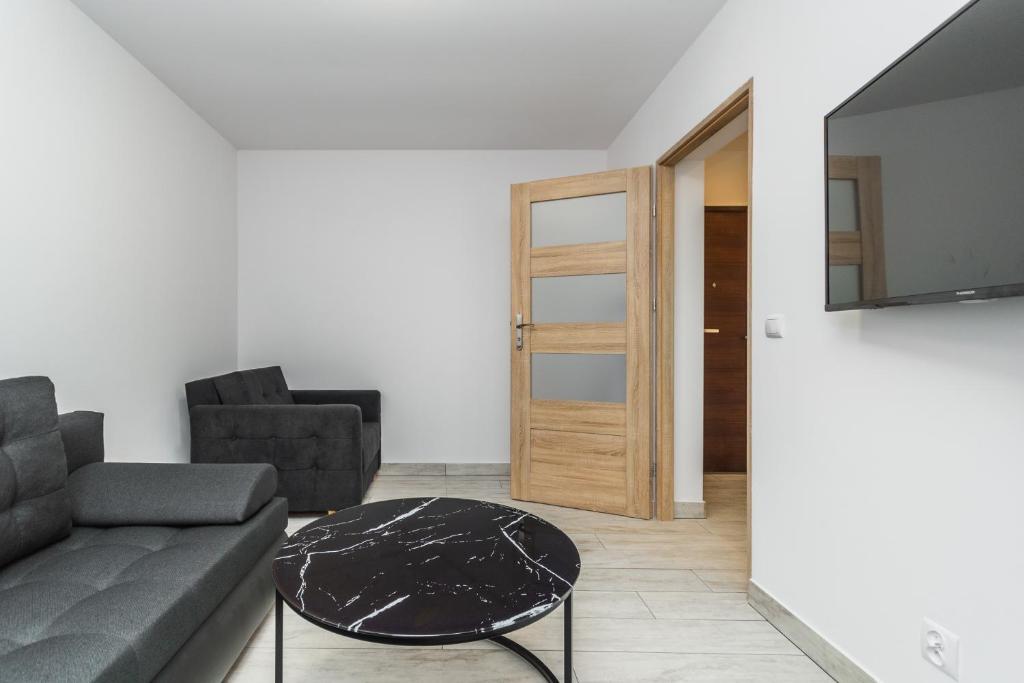 Posezení v ubytování VIP House Apartamenty