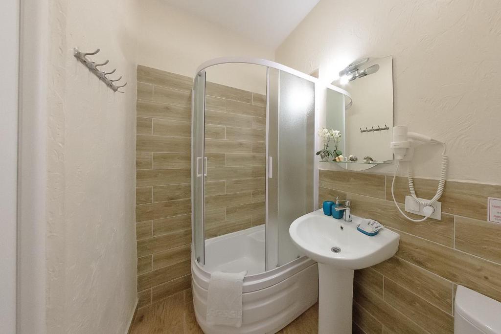 Koupelna v ubytování Apart-Hotel Poseidon