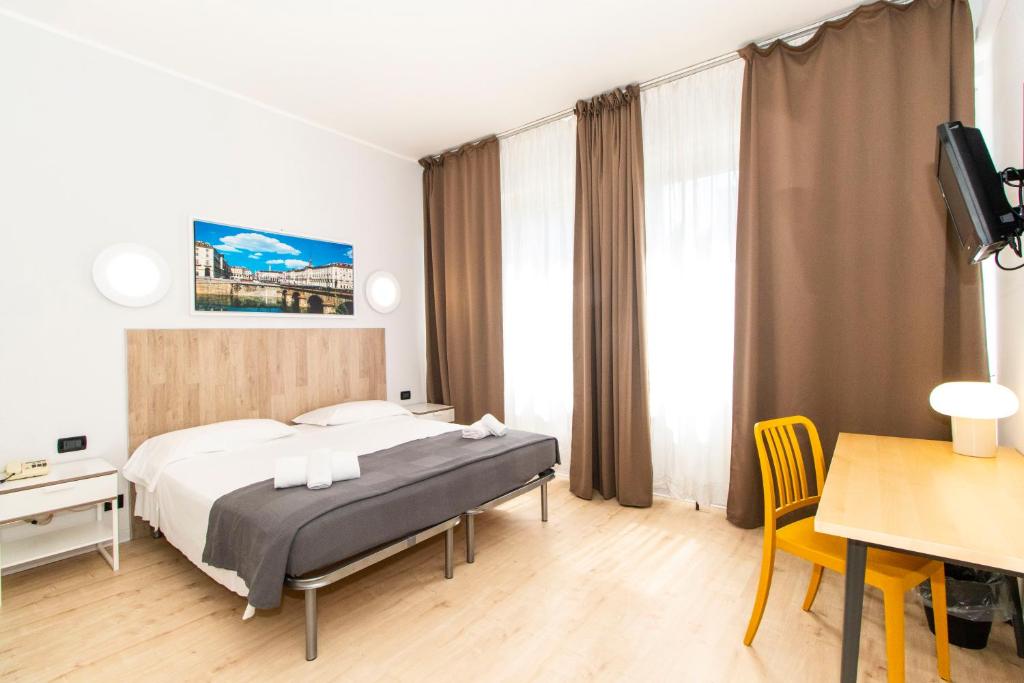 Postel nebo postele na pokoji v ubytování Hotel Cristallo Torino