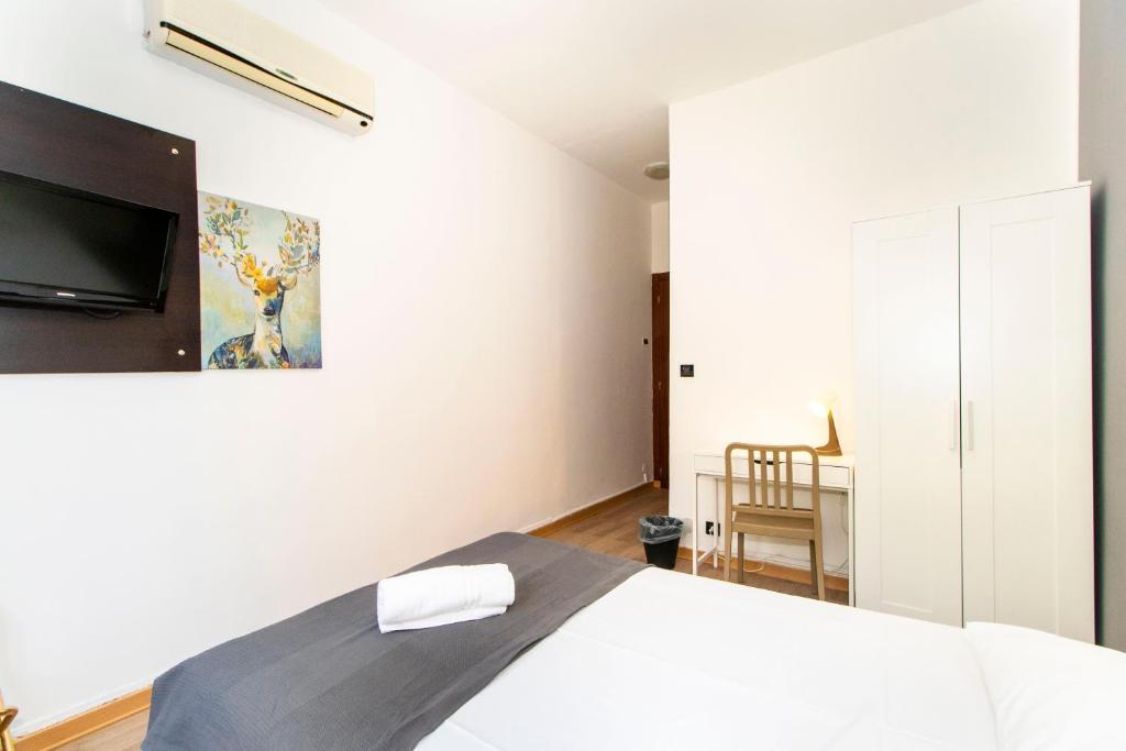 Postel nebo postele na pokoji v ubytování Hotel Cristallo Torino