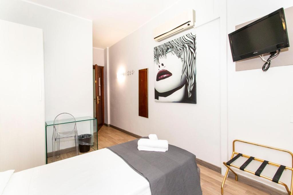 Postel nebo postele na pokoji v ubytování Hotel Cristallo Torino