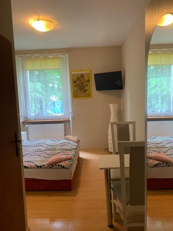 Posteľ alebo postele v izbe v ubytovaní Apartamenty pokoje "MARIA"
