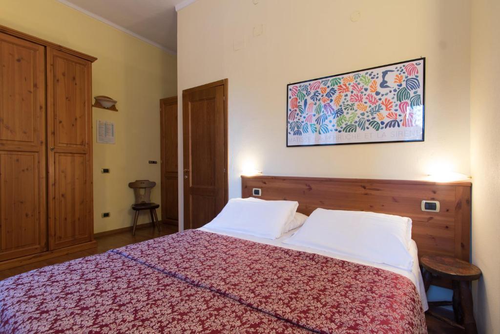 Postel nebo postele na pokoji v ubytování Limone Palace Aparthotel