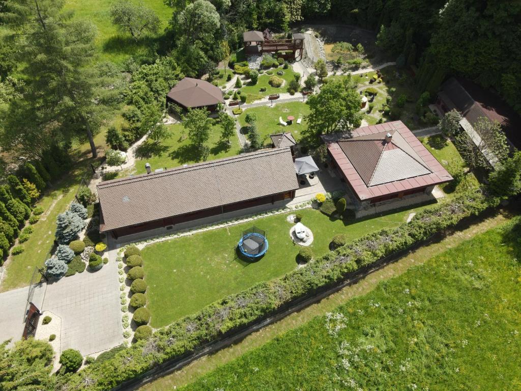 an overhead view of a house with a yard at Dukla Ranč in Nižný Komárnik